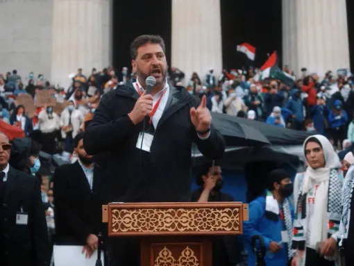 A screenshot from an AMP mashup video from June 2021 showing AMP Executive Director Dr. Osama Abuirshaid speaking at a demonstration in Washington, D.C., standing alongside Nerdeen Kiswani and Abdullah Akl, leaders of radical anti-Zionist group Within Our Lifetime (WOL)