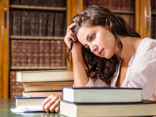 Stressed woman during an exams on the classroom
